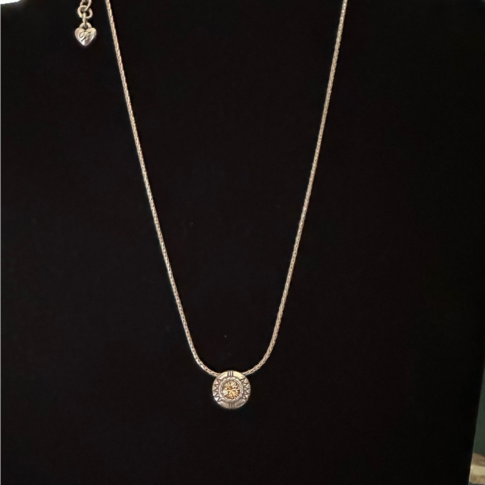16-19” reversible pendant. Yellow tone stone and clear stone.